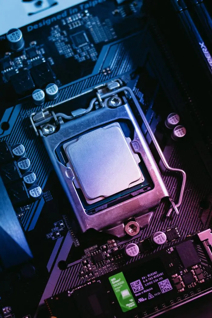 Detailed close-up of a computer motherboard highlighting the CPU socket with electronic components.
